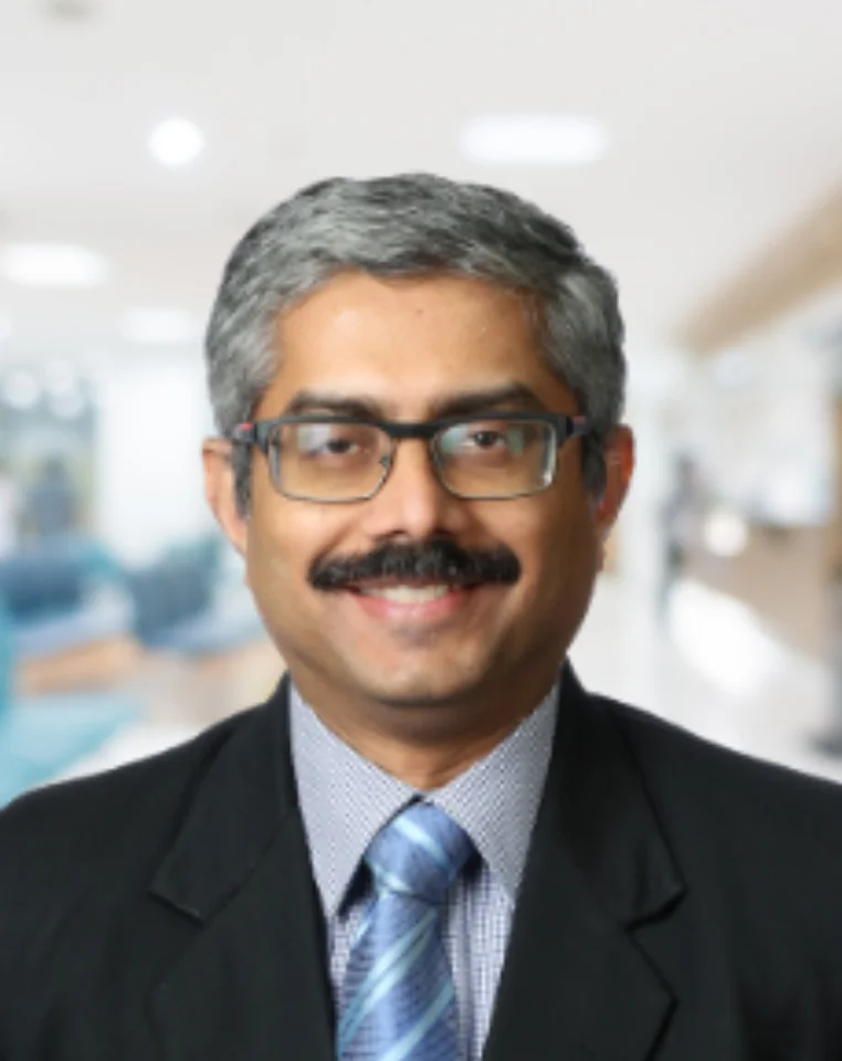 Dr. Mohan Menon